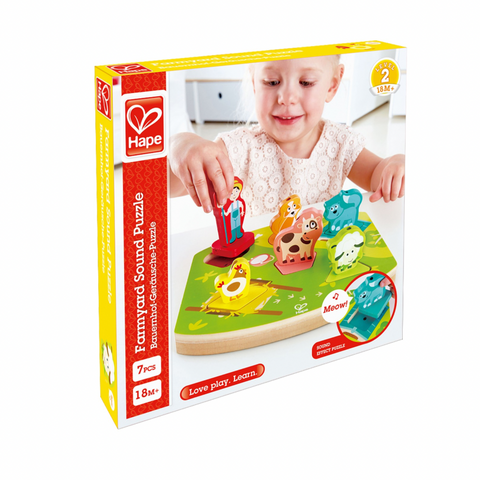 Hape family yard sound puzzle packaging with a child playing with the puzzle.