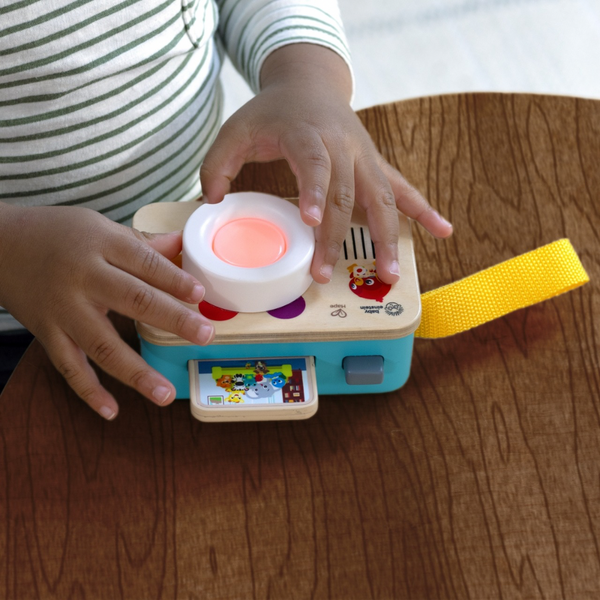 Baby using Baby Einstein Learning Lens by Hape – Sensory toy promoting curiosity and exploration
