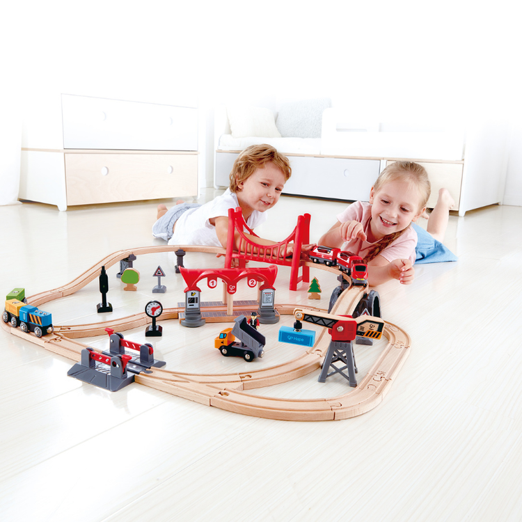 Children playing with wooden train set in Nairobi