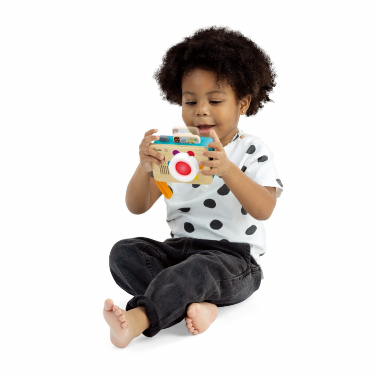 Baby using Baby Einstein Learning Lens by Hape – Sensory toy promoting curiosity and exploration
