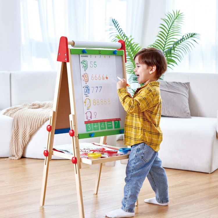 Hape Letters and Numbers Tracing Hape, Preschool child in Kenya using Hape Letters and Numbers Tracing Set – Fun Educational Toy for Early Learning