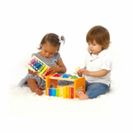 Toddler playing with Hape Pound and Tap Bench – educational wooden toy that builds coordination and rhythm, sold by Cheza Plus Kenya.