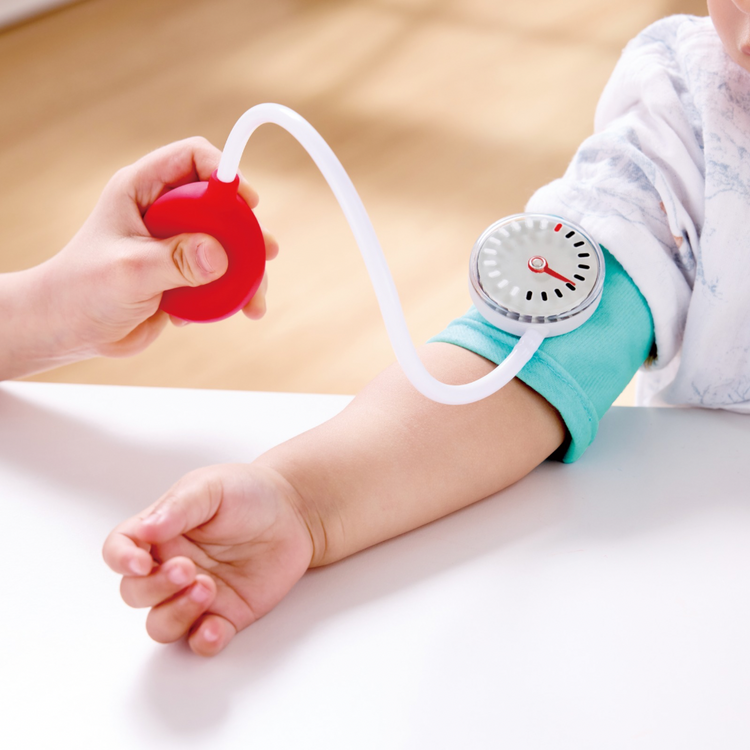 Pretend checkup scene using Hape Little Doctor set - imaginative play in Kenya