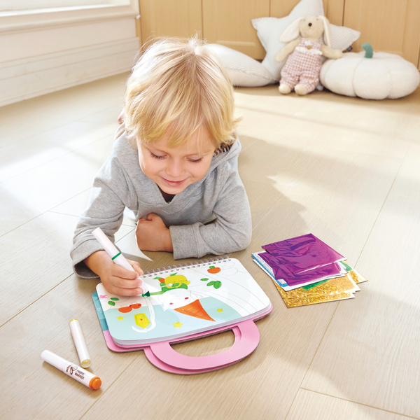 Child creating foil artwork with Hape Enchanted Travel Foil Art Kit – creative craft toy for kids in Kenya from Cheza Plus.