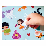 Close-up of Hape Enchanted Travel Foil Art Kit showing shiny foil sheets and illustrated templates, sold by Cheza Plus Nairobi.