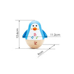 Close-up of Hape Penguin Musical Wobbler rocking side to side – fun baby toy that encourages movement and coordination, sold by Cheza Plus Kenya.