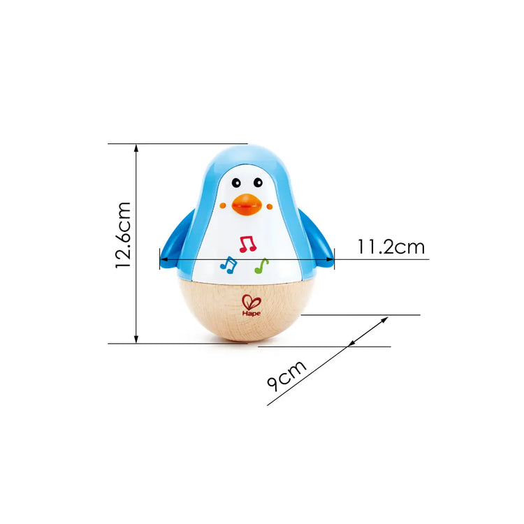 Close-up of Hape Penguin Musical Wobbler rocking side to side – fun baby toy that encourages movement and coordination, sold by Cheza Plus Kenya.