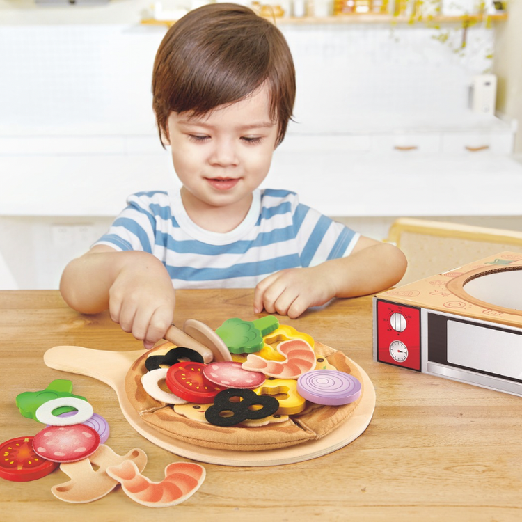 Children playing with pizza playset toy in Nairobi