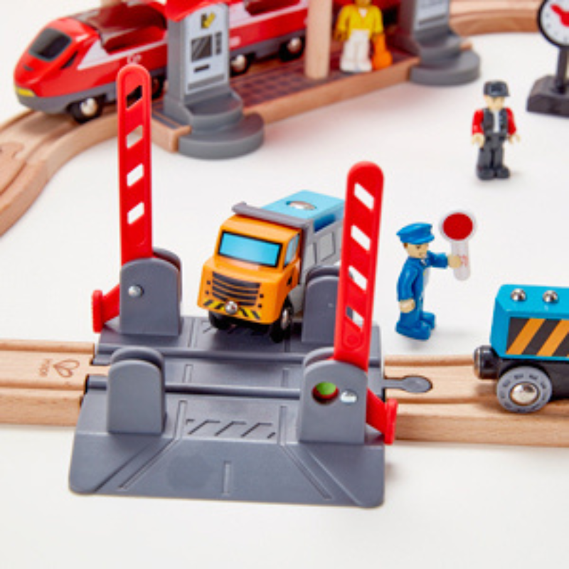 Toy train set with traffic lights, trucks, and figures on a white background, Hape Busy City Rail Set CHEZA PLUS